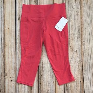 Athleta Women's Coral Salutation Stash Pocket II Capri Leggings